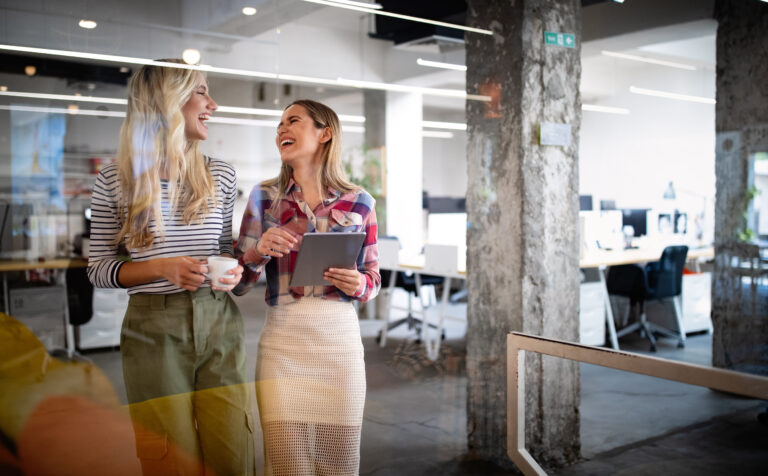 Business people having fun and chatting at workplace office